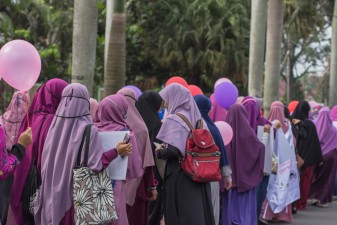 لماذا ترث المرأة نصف ما يرثه الرجل في الشريعة الإسلامية؟